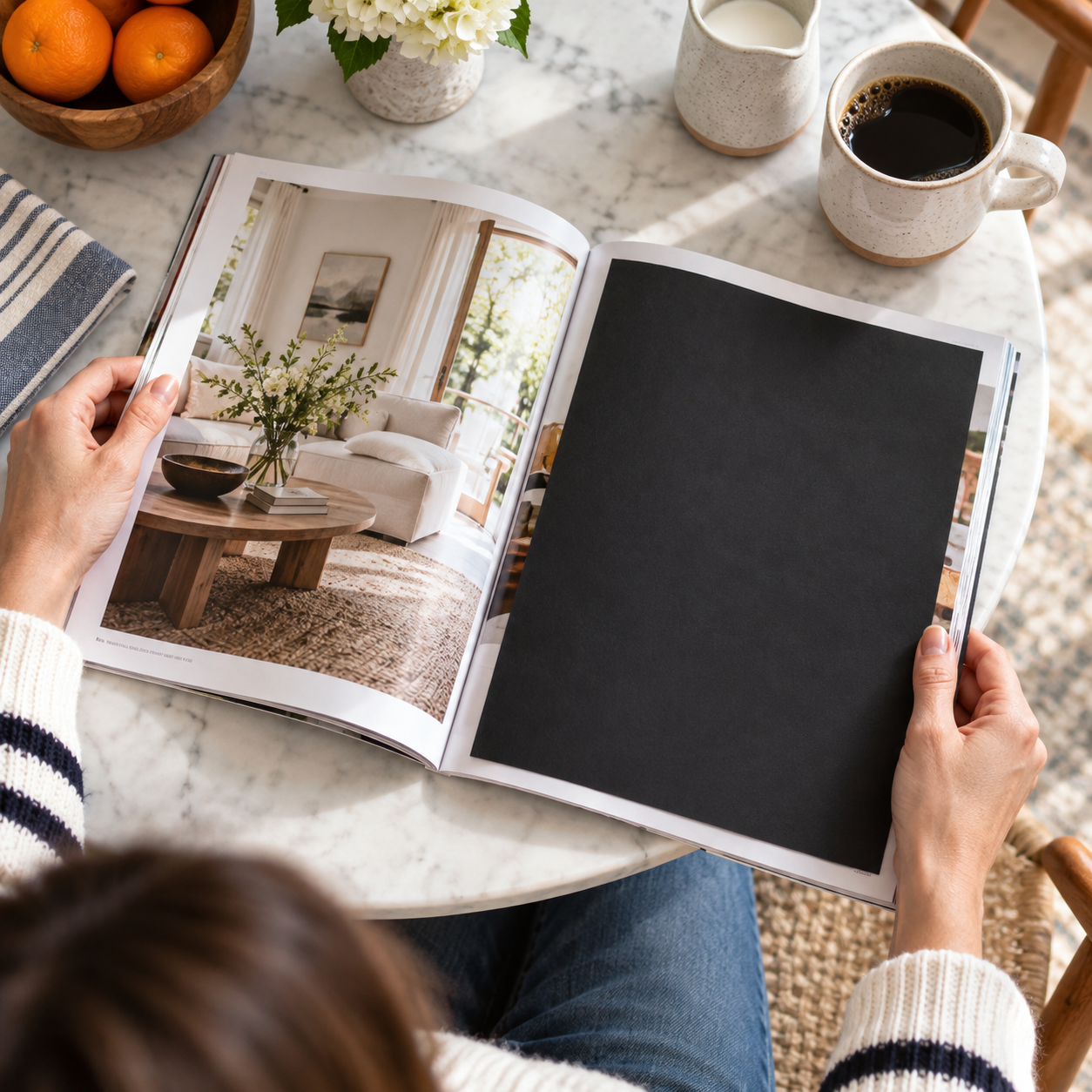 A black sheet blocks an advertisement in a magazine on a table